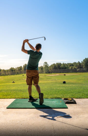Young man playing golf in summer. Unrecognisable person. High quality photo